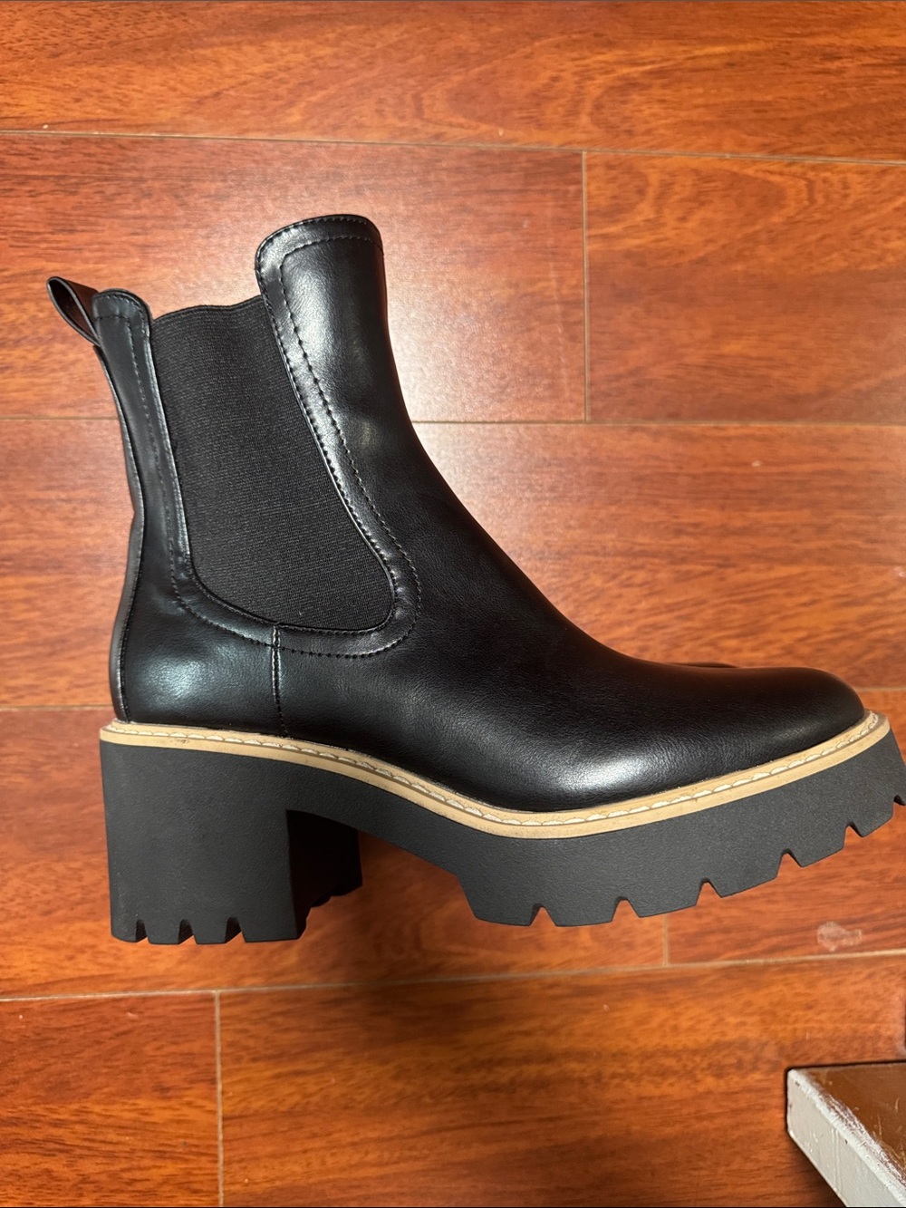 DV by Dolce Vita Black Leather Lug-Sole Chelsea Booties with Tan Trim
